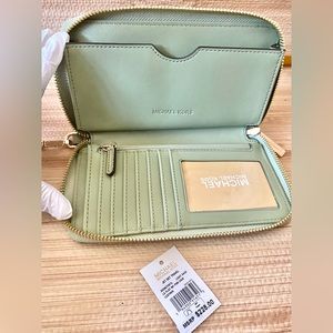 SOLD OUT Michael Kors Jet Set Multi-function Phone Holder/Wristlet/Wallet.